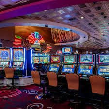 Mobile phone showing sukabet365 live casino dashboard with cashback balance visible